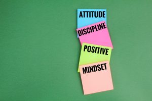 colored paper with words for successful attitude, discipline, positive, mindset
